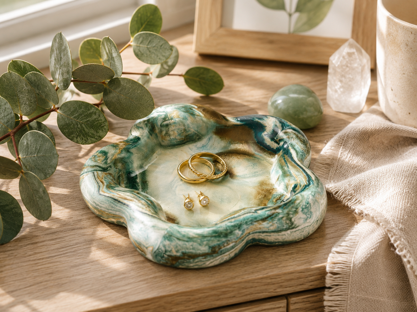 Handcrafted botanical green resin catchall dish with floral-inspired shape and marbled finish.