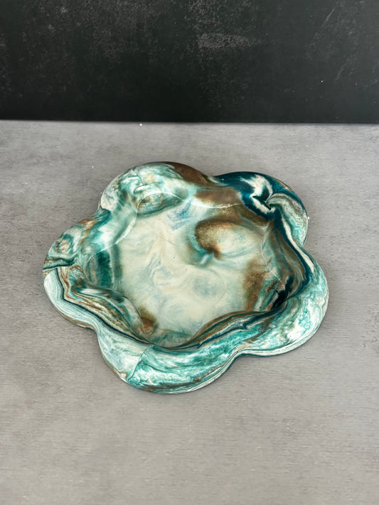 Handcrafted botanical green resin catchall dish with floral-inspired shape and marbled finish